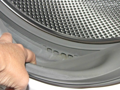 How do you clean a Kenmore washing machine?